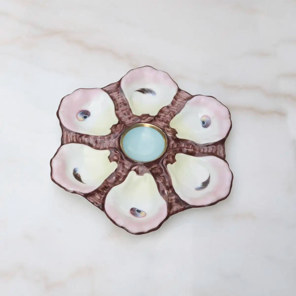 Vintage Limoges oyster plate with elegant mauve accent glaze