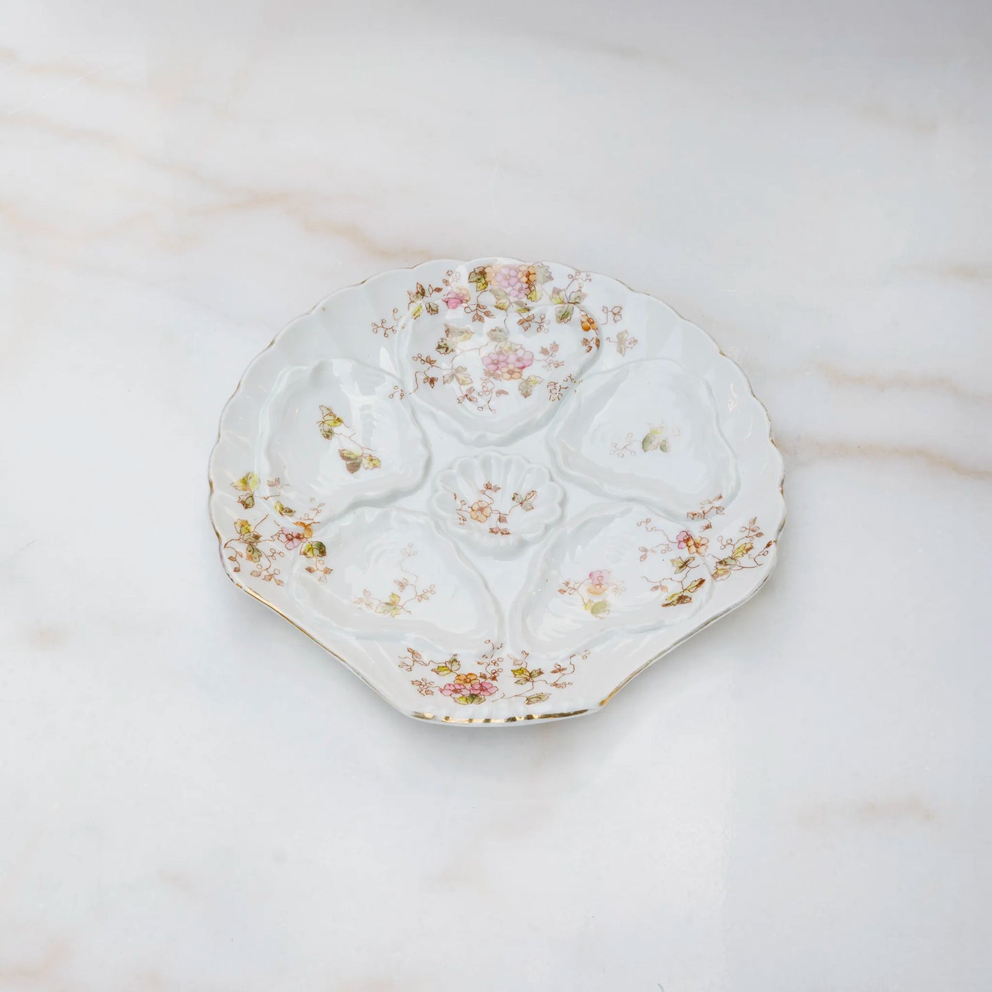 Limoges oyster plate in white porcelain with delicate flowers