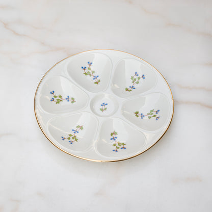 Limoges oyster plate with blue floral sprays on white ground