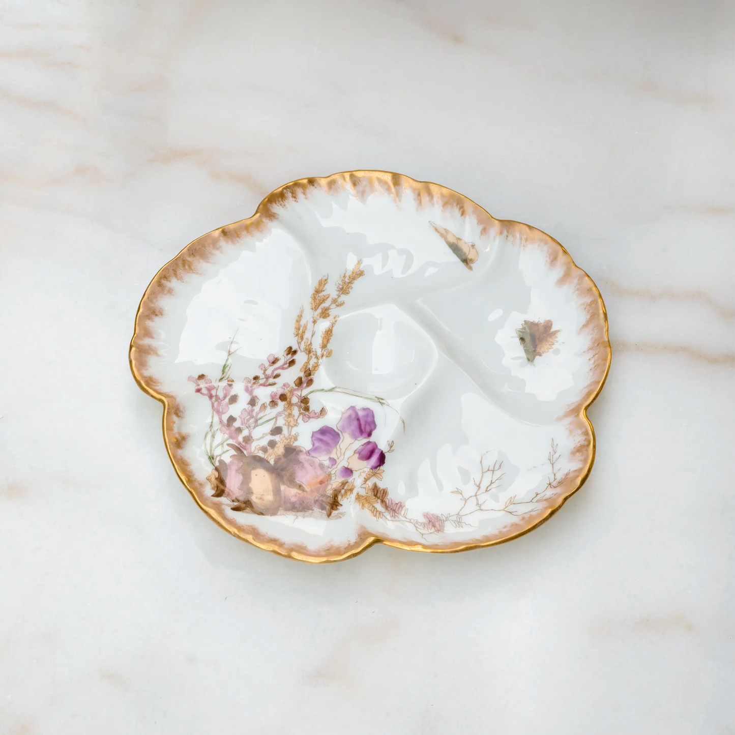 Limoges porcelain oyster plate with conch shell and purple flowers