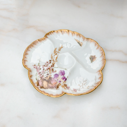 Limoges porcelain oyster plate with conch shell and purple flowers