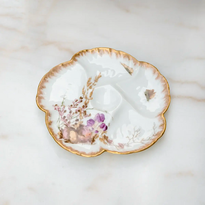 Limoges porcelain oyster plate with conch shell and purple flowers