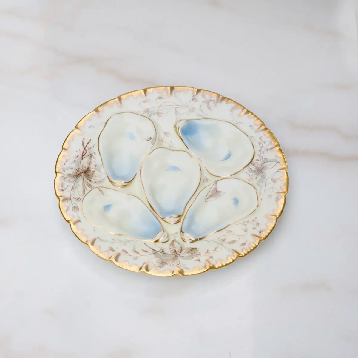 Vintage Haviland Limoges oyster plate with blue floral design and gold trim