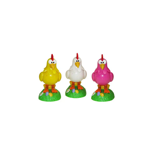 Three Kookoo Cluckin Chicken Candy Dispensers in yellow, white, and pink with colorful candy eggs on green bases.