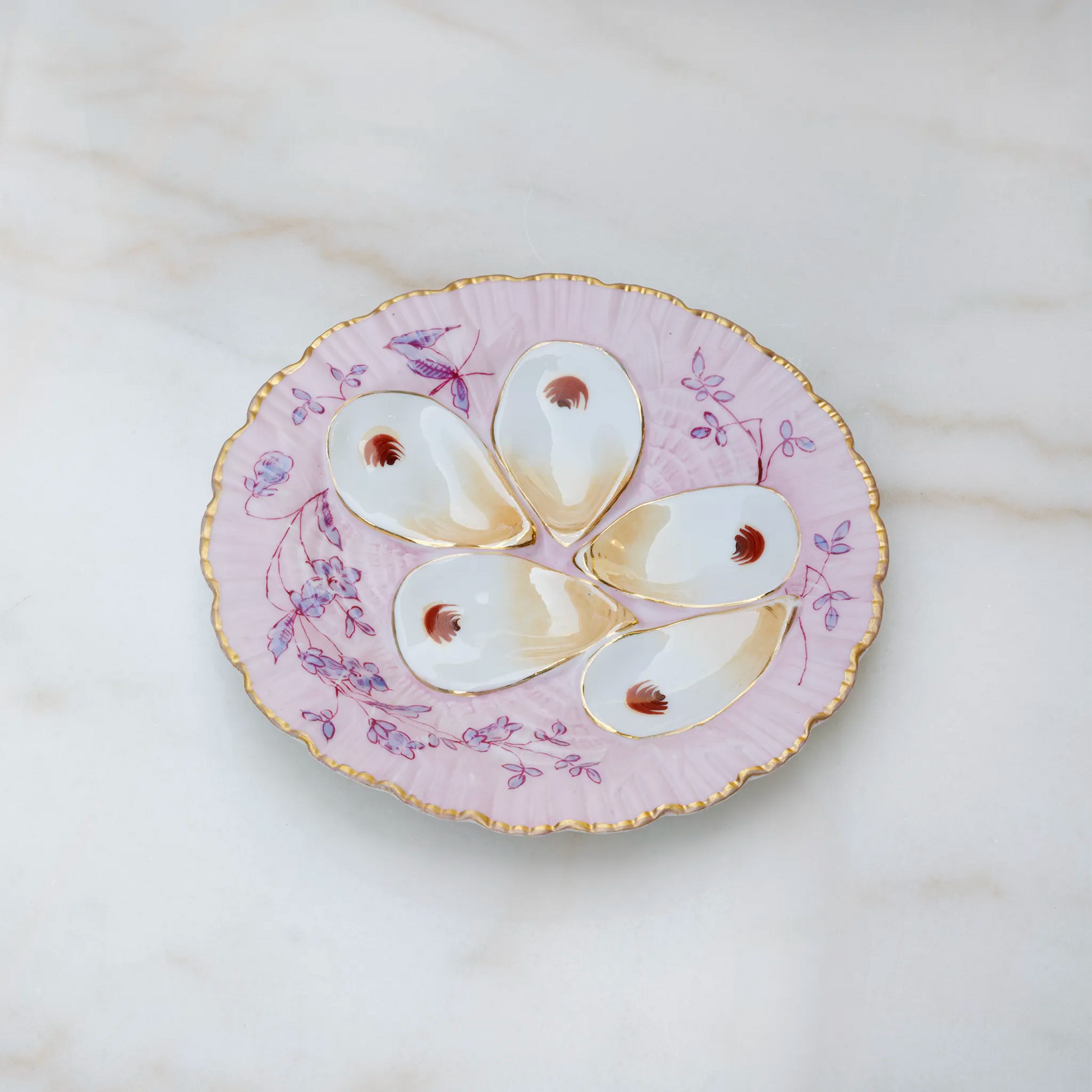 Limoges oyster plate in soft pink with gold accent edging